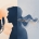 Human voice actor vs AI voice - silhouette with microphone turning into digital sound waves